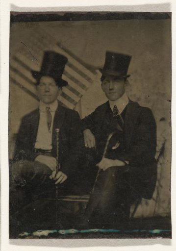 Portrait of two unknown men on a bench