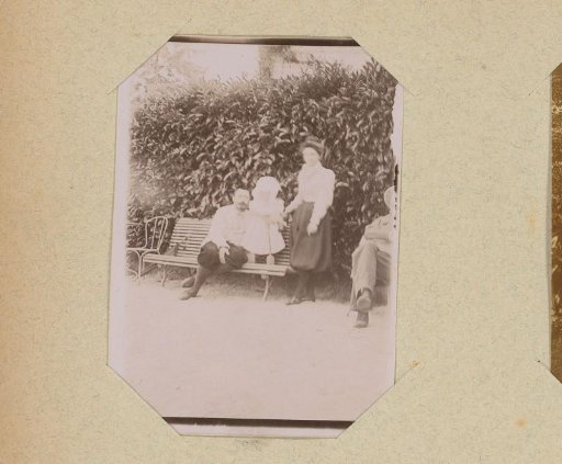 Group portrait of a man, woman and child in a garden