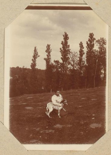 Woman with a dog in a field