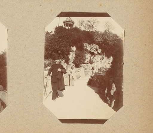 Man and Two Women in a Park or Garden with a Pavilion