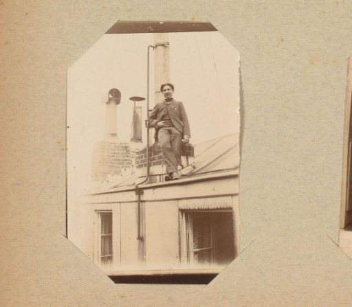 Young man standing on a roof