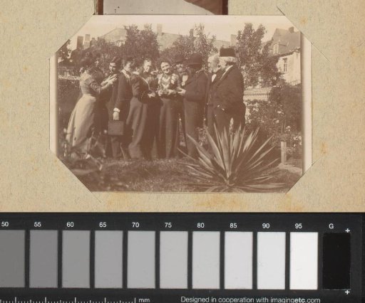 Group portrait of a company in a garden