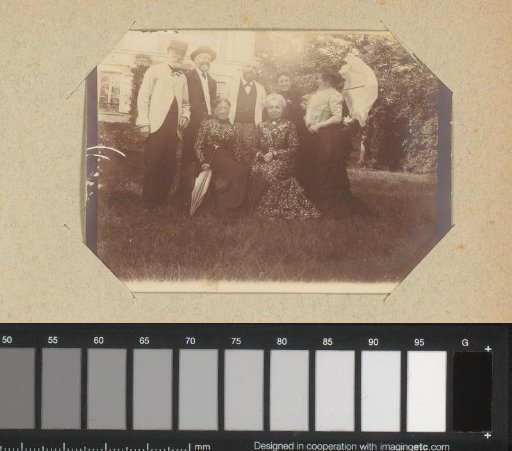 Group portrait of a company in a garden