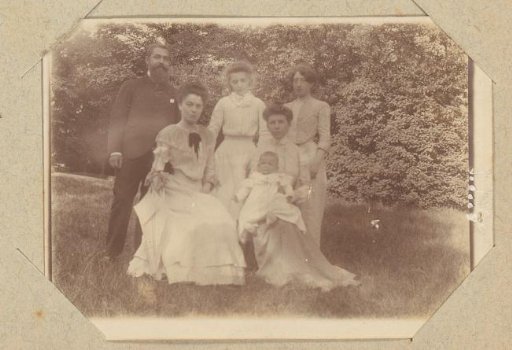 Group portrait of a company in a garden