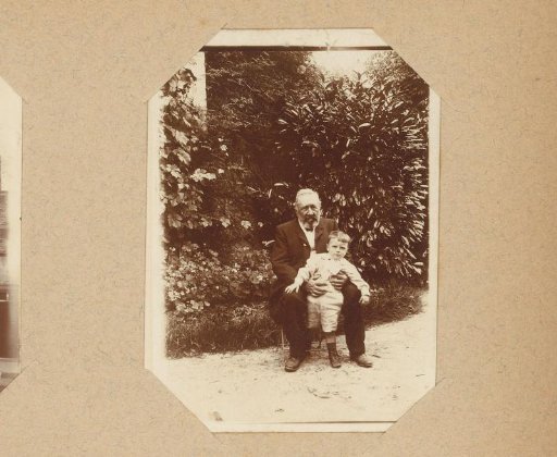 Portrait of an old man and a boy in a garden