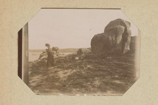 Woman among rock formations on the coast