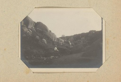 Woman among rocky outcrops