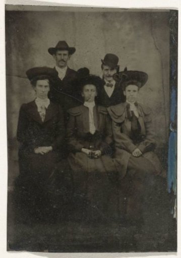 Group portrait of three men and two women