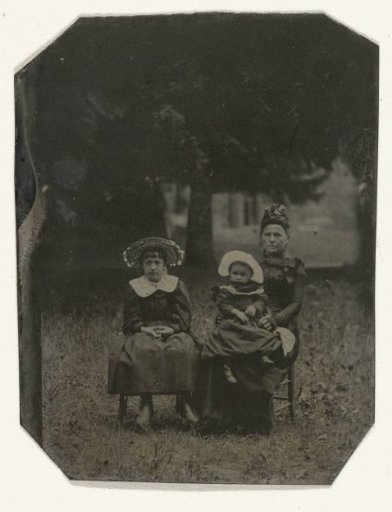 Portrait of a Woman, a Girl, and a Small Child, Sitting on Chairs in a Forest (?)