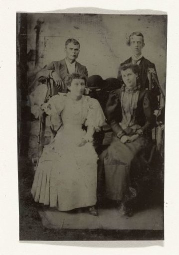 Portrait of Two Men and Two Women, Standing and Sitting in Front of a Painted Backdrop (Lighthouse)