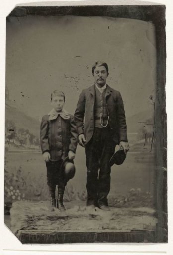 Portrait of a Man and a Boy, Standing Before a Painted Backdrop (Mountains)
