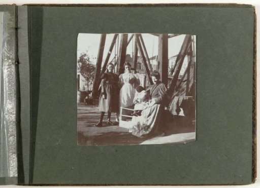 Group Portrait of Three Women and a Child at the Foot of a Derricks Tower, United States