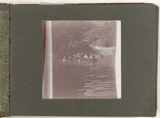 Group swimming and in a rowing boat, Cupsuptic Lake, Maine