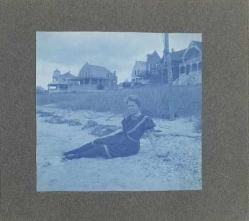 Woman sitting on the beach, United States