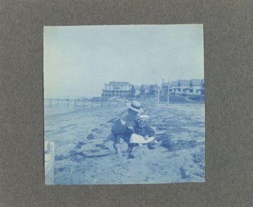 Woman with a child on the beach, United States