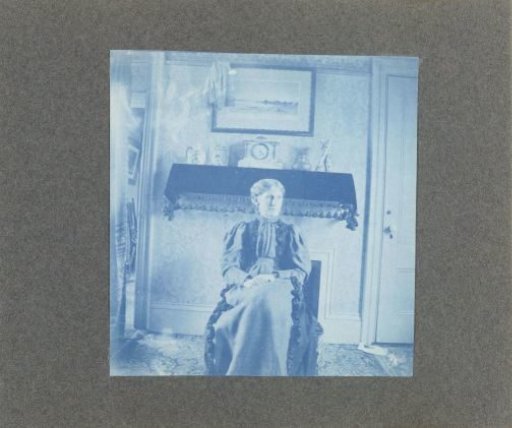 Woman sitting in an interior, United States