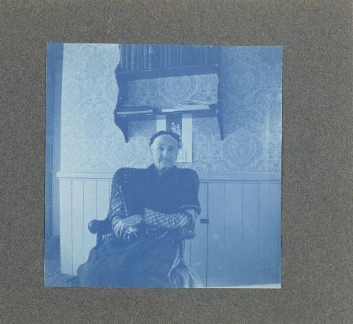 Woman sitting in an interior, United States