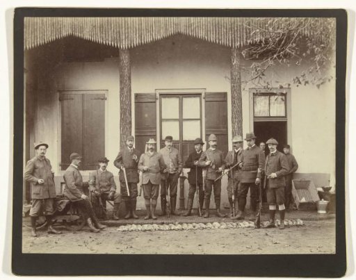 Group portrait of hunters and helpers, including Henry Pauw van Wieldrecht and Maarten Pauw van Wieldrecht, with the hunted game at their feet