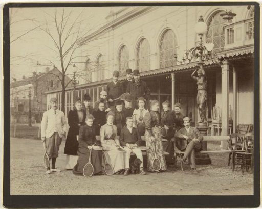 Group portrait at the tennis club, with the photographer at the far left