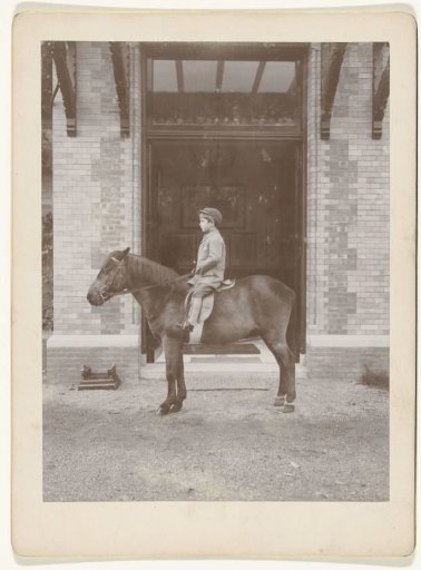 Boy on horseback, seen from the side
