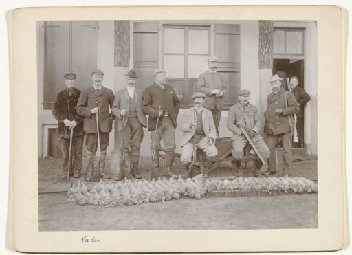 Group portrait of hunters and helpers, including Henry Pauw van Wieldrecht and Maarten Pauw van Wieldrecht, with the hunted game at their feet