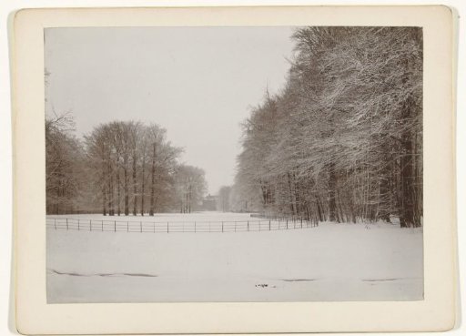 Snow-covered park with Castle Zeist in the background