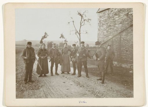 Group portrait of hunters and helpers, including a shot wild boar (third from the right: Henry Pauw van Wieldrecht)