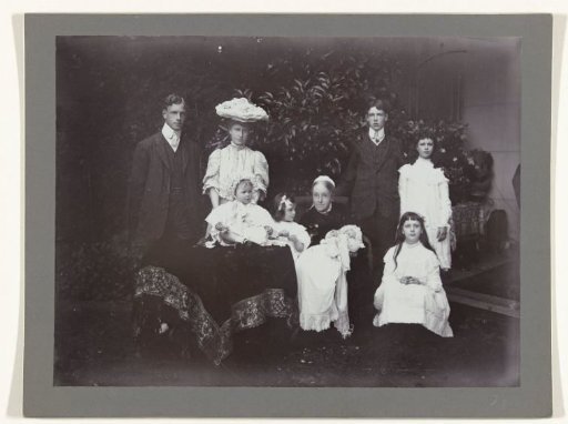 Group portrait of nine persons, including Aletta Cornelia Anna Voombergh (1828-1913), the mother of the photographer