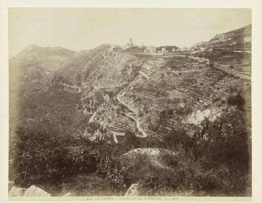 Artificial terraces and mountain paths against a steep mountain slope near Menton