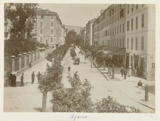 Street scene with horse-drawn carriages in a street in Ajaccio