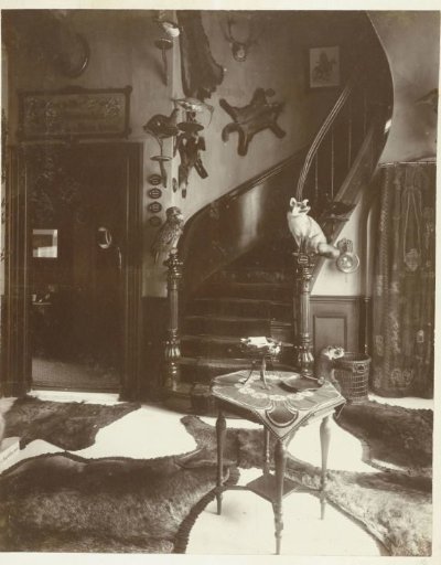 Staircase in the hall of the country house De Wildbaan with hunting trophies