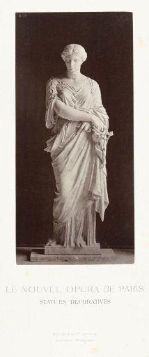Marble statue of a woman in a robe with crossed arms.
