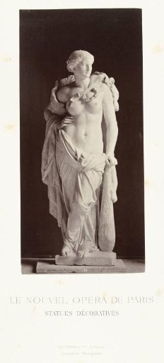 Marble statue of a woman with bare breasts and a club in her hand.
