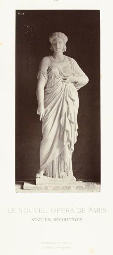 Marble statue of a woman in a robe with a bare breast, pointing downwards with the index finger of her right hand.