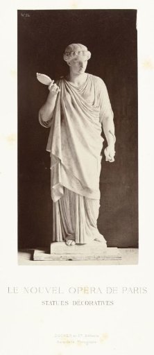 Marble statue of a woman in a high-closed dress, holding a mirror in her right hand and a snake in her left.