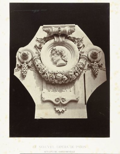 A relief depicting Halevy Fromental with a fruit garland below
