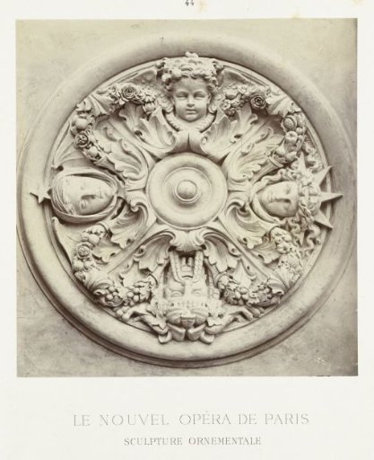 Round ceiling ornament, a relief depicting the four winds in heads