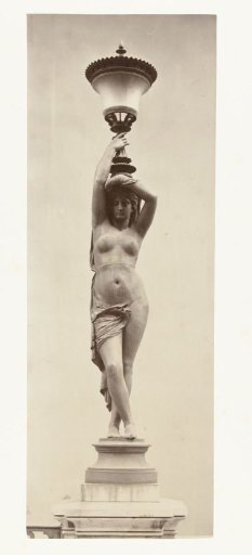 Floor lantern in the form of a naked lady, holding a chalice on her head