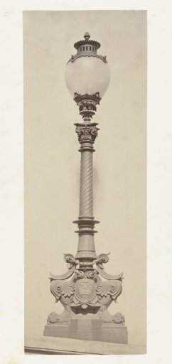 Lantern with a glass globe, resting on a twisted bronze stand standing on a bronze base in the form of animal paws