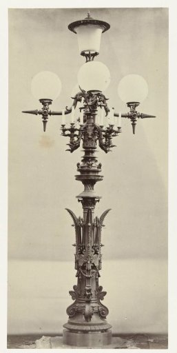 Lantern with four glass globes and a glass cylinder in the center, surrounded by a candelabrum, the whole resting on a decorated bronze stand