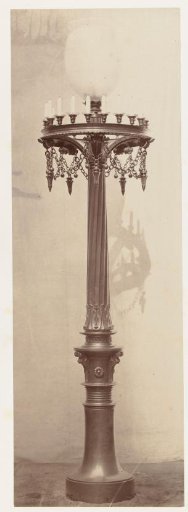 Lantern with a glass globe, surrounded by a candelabrum, the whole resting on a bronze base with ornaments