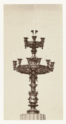 Bronze candelabrum with three tiers resting on a base provided with ornaments