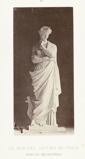 Marble statue of a woman in a robe with a bare breast