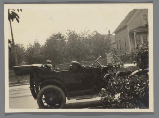 Parked car with a child in the back seat