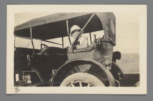 Woman in the back seat of a car