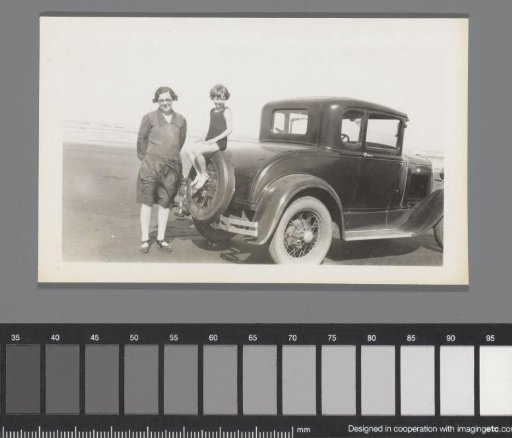 Ford Model A Coupe with a woman and child on the beach