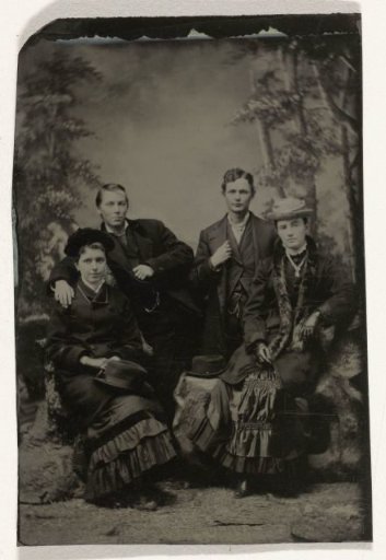 Two Men and Two Women, Standing and Sitting in Front of a Painted Backdrop (Forest)
