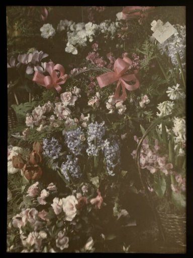 Bouquet of flowers with ribbon, basket and card