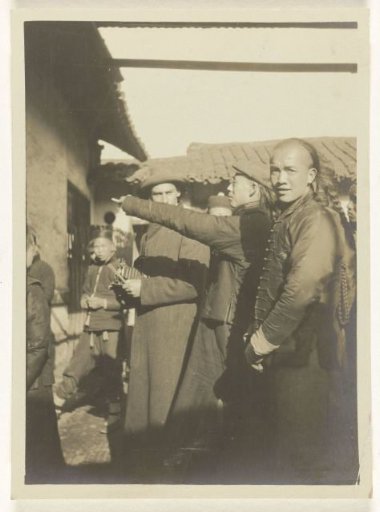 Chinese people and a travelling companion in Shanghai