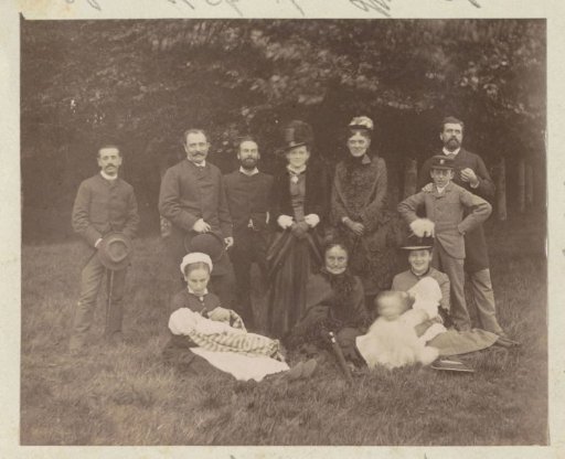 Group portrait of a French family on a lawn